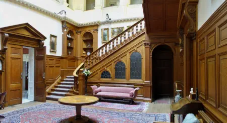 Wide angle of the central panelled hall. A 3-story open space.